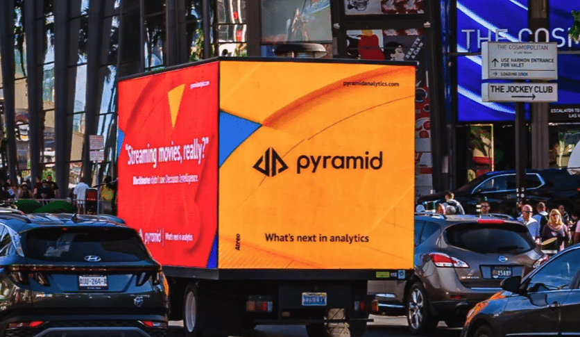 digital led billboard truck advertising in a busy city street